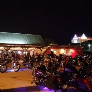 motorcycles parked outside of bar