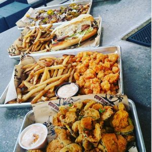 five trays of delicious food